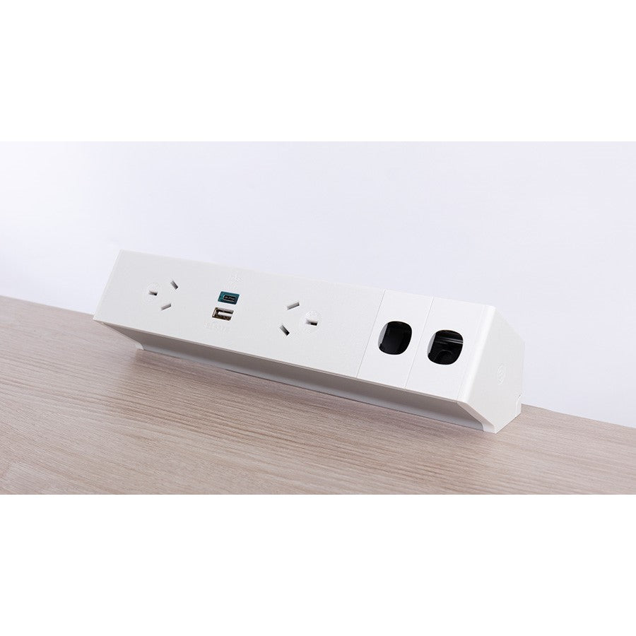 White power strip with multiple outlets on a wooden surface