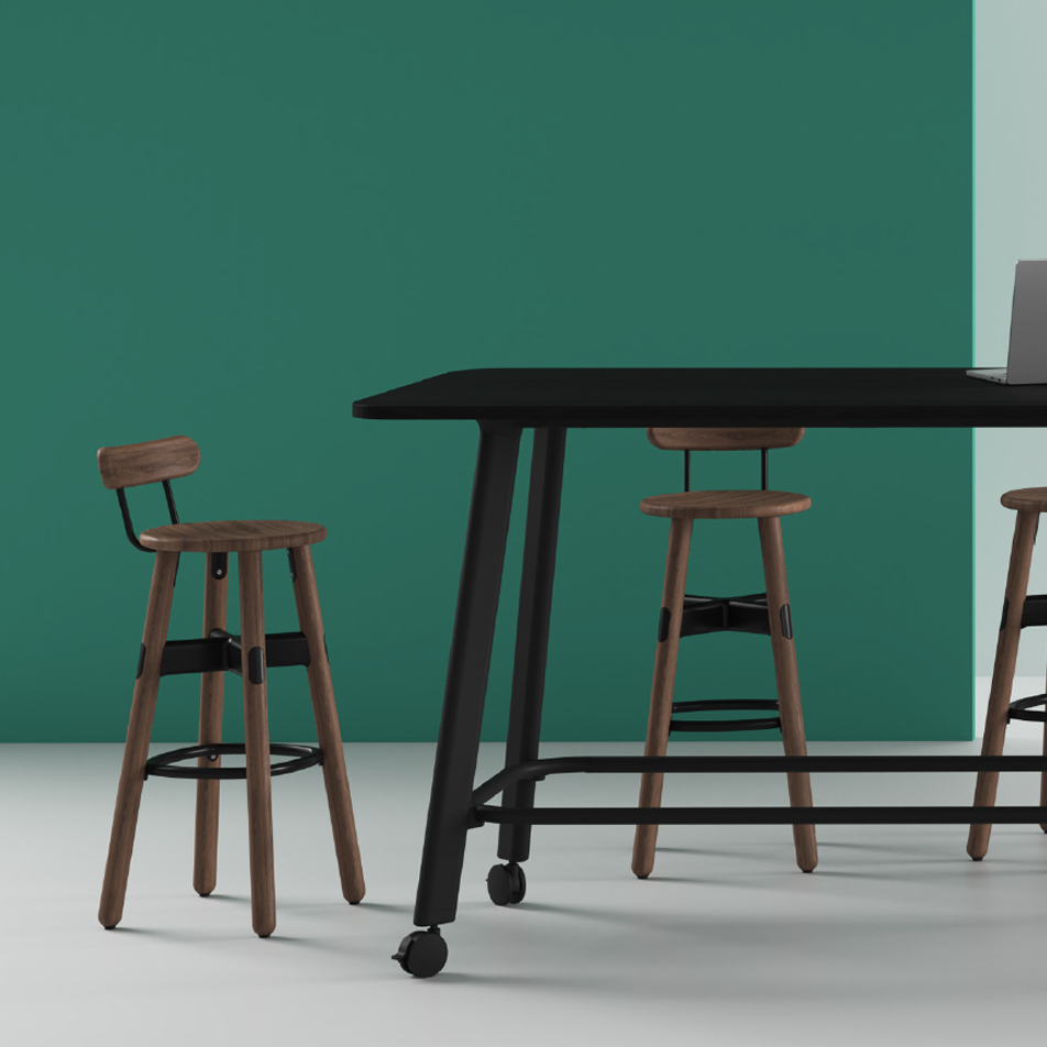 A standing height table from the Rosie Table collection. Featuring a black finish, optional footrails and castor wheels.