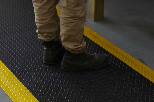 Diamond Step Anti-Fatigue mat in industrial workspace.