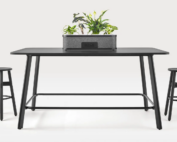 Rosie rectangular meeting table (standing height) positioned with chairs and planter accessory.