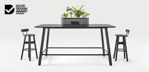Rosie rectangular meeting table (standing height) positioned with chairs and planter accessory.